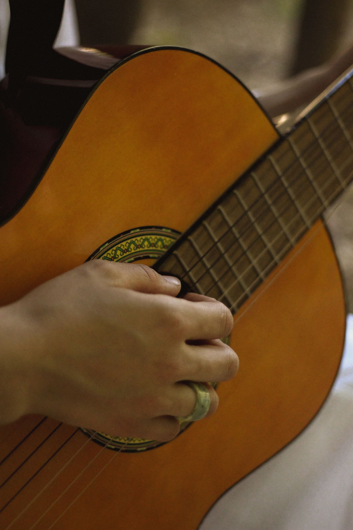 A classical nylon-string guitar being played