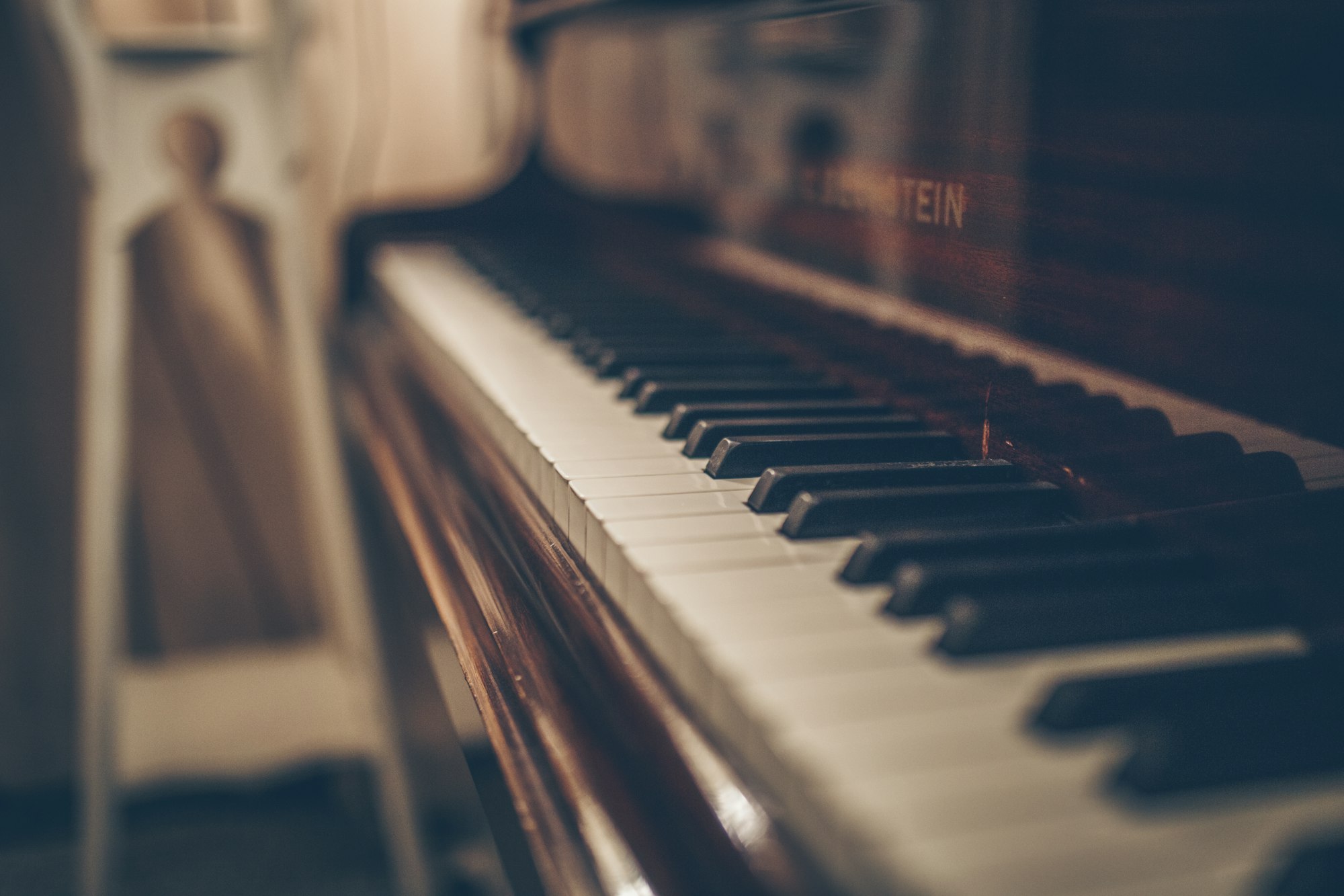 Grand piano in a warm, sunlit studio