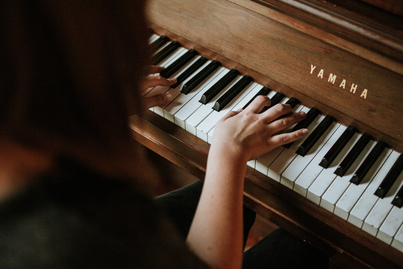Close view of piano keys in warm light